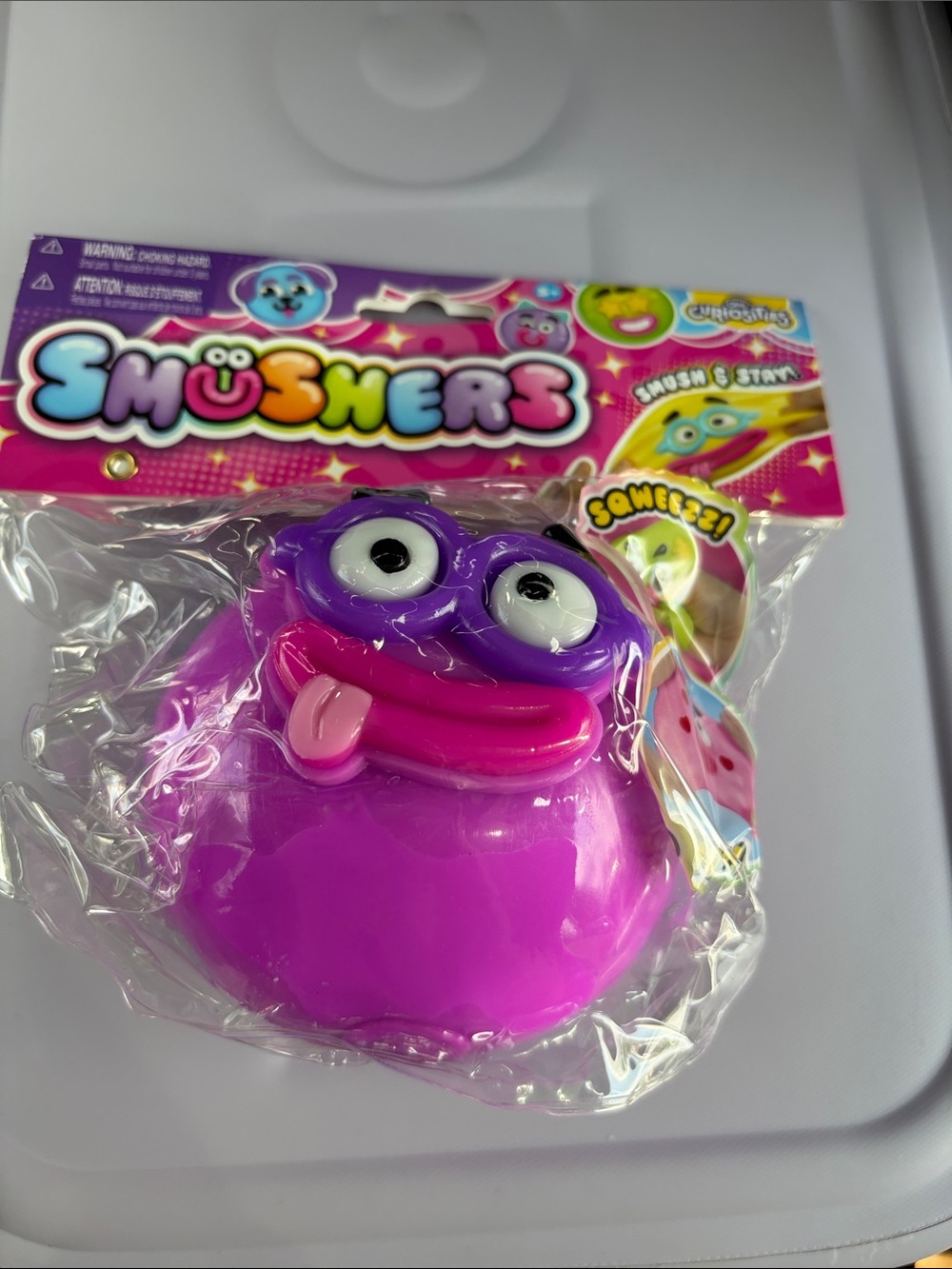 Smushers Purple Squeezable Toy with purple  face and pink mouth NEW AUTHENTIC